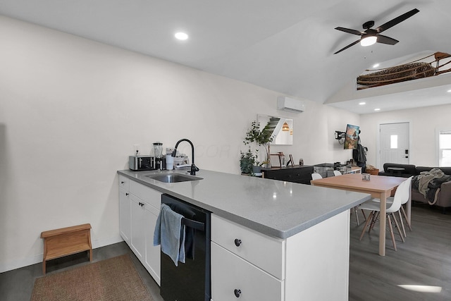 kitchen featuring an AC wall unit, sink, ceiling fan, black dishwasher, and white cabinetry