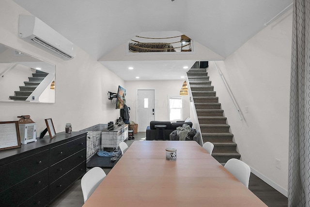 dining space featuring wood-type flooring and a wall unit AC