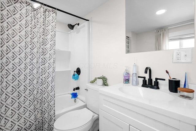 full bathroom featuring shower / tub combo, vanity, and toilet