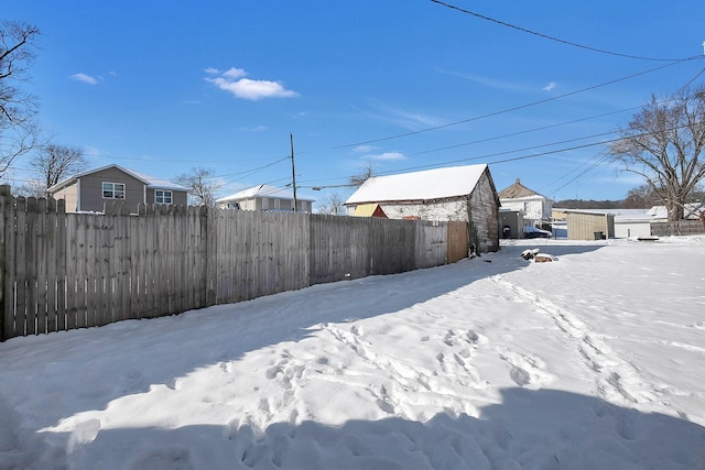 view of yard layered in snow