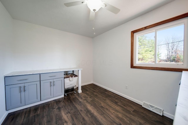 washroom with ceiling fan and dark hardwood / wood-style flooring