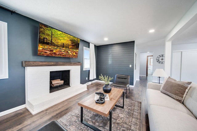 living room featuring hardwood / wood-style floors and a fireplace