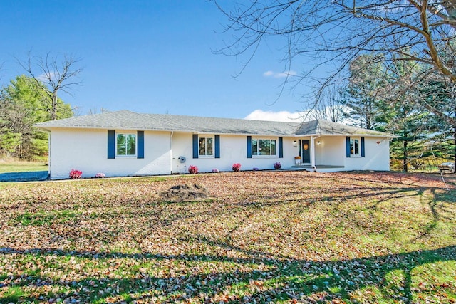 ranch-style house with a front lawn