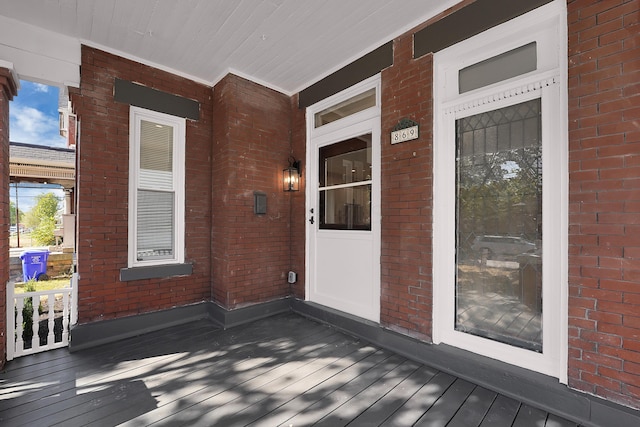 wooden deck featuring covered porch