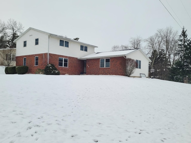 view of snow covered house