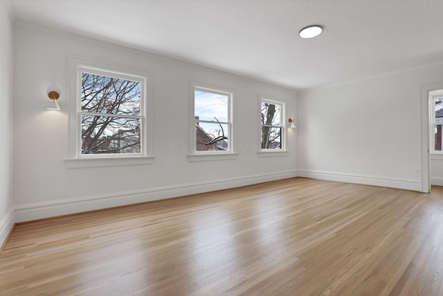 unfurnished room featuring light wood-type flooring