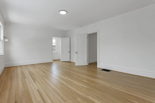 unfurnished room featuring light wood-type flooring