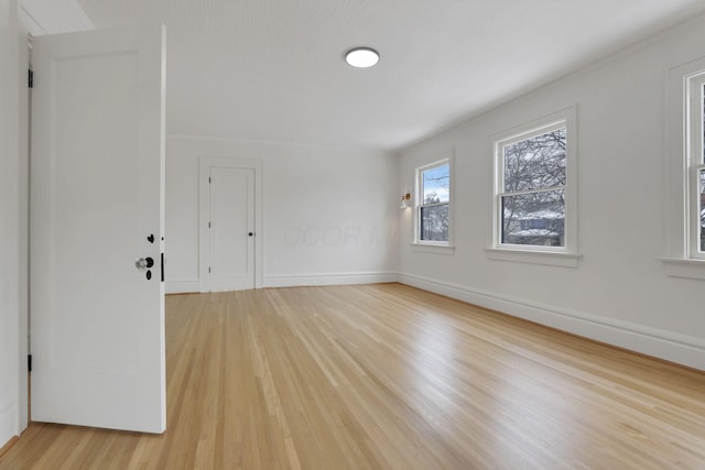 empty room with light hardwood / wood-style floors