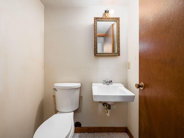 bathroom with sink and toilet