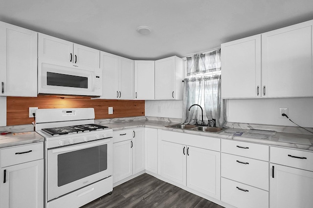 kitchen featuring sink, white cabinets, dark hardwood / wood-style floors, and white appliances