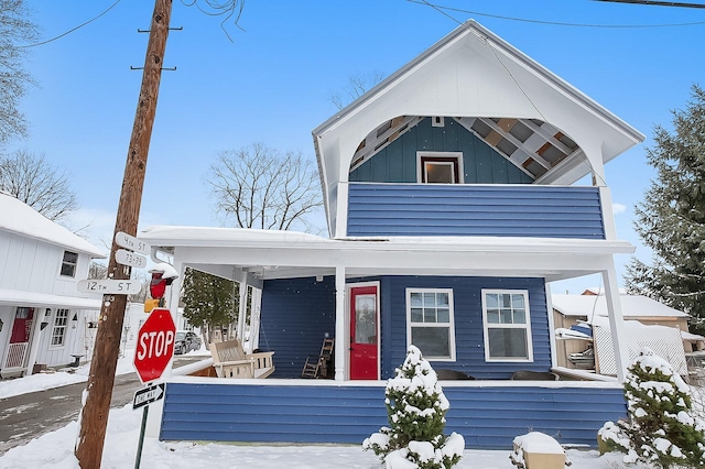 view of front of house with a balcony and a porch