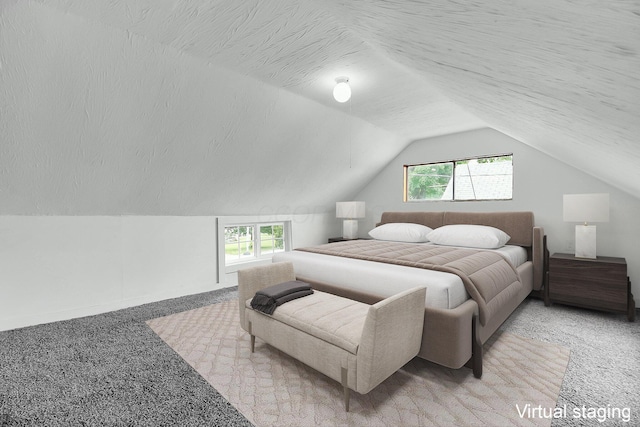 carpeted bedroom featuring a textured ceiling, multiple windows, and lofted ceiling