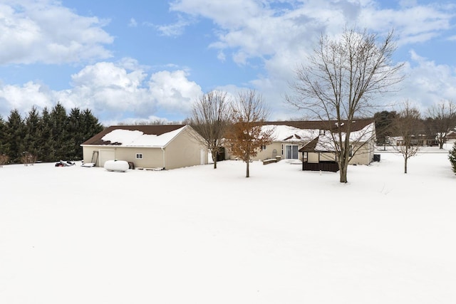 view of yard layered in snow