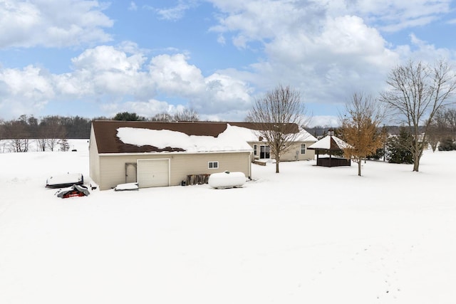 view of snow covered house