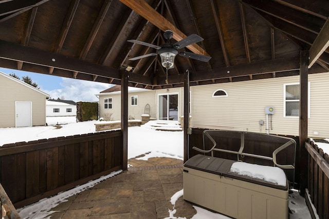 snow covered patio with a gazebo