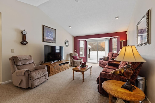 carpeted living room featuring lofted ceiling