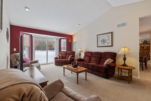 living room featuring light carpet and lofted ceiling