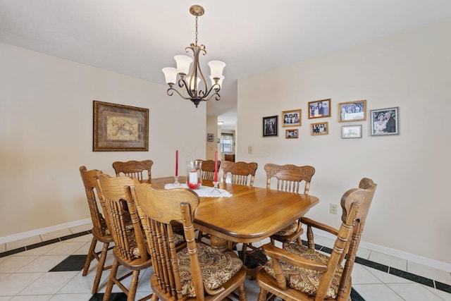 dining space with light tile patterned floors and a notable chandelier