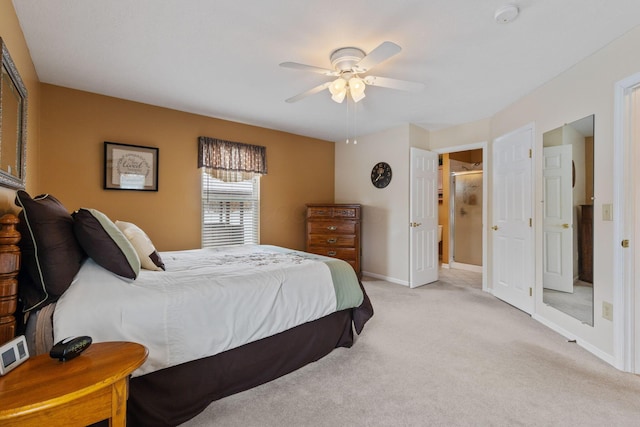 bedroom with ceiling fan and light carpet