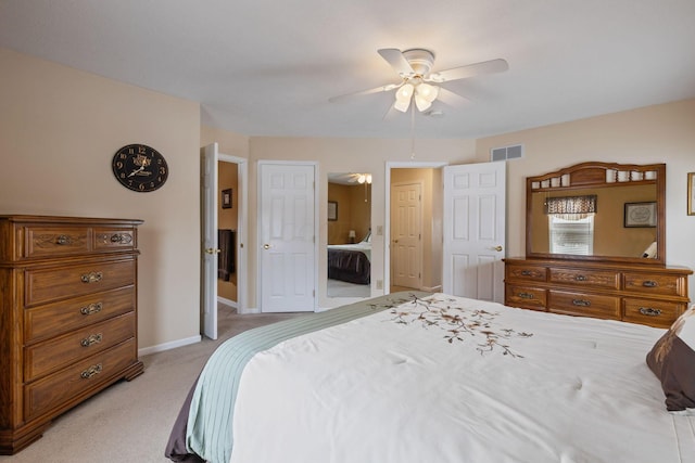 bedroom with ceiling fan and light carpet