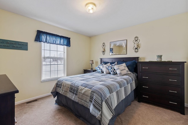 bedroom with light colored carpet