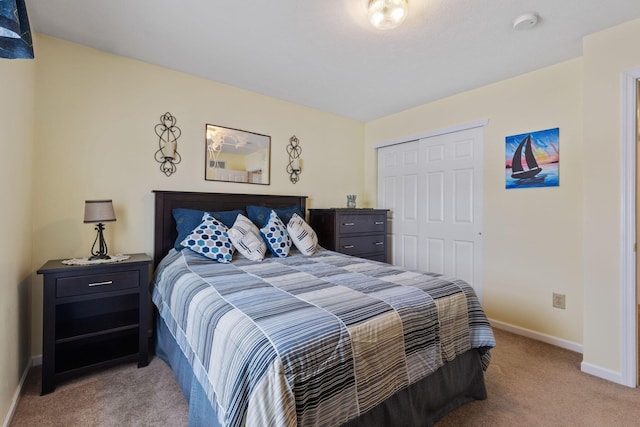 bedroom featuring light carpet and a closet