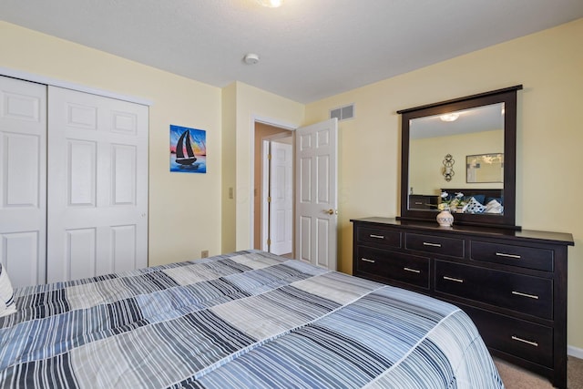 carpeted bedroom featuring a closet