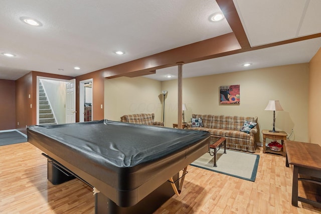 recreation room with light hardwood / wood-style floors and pool table