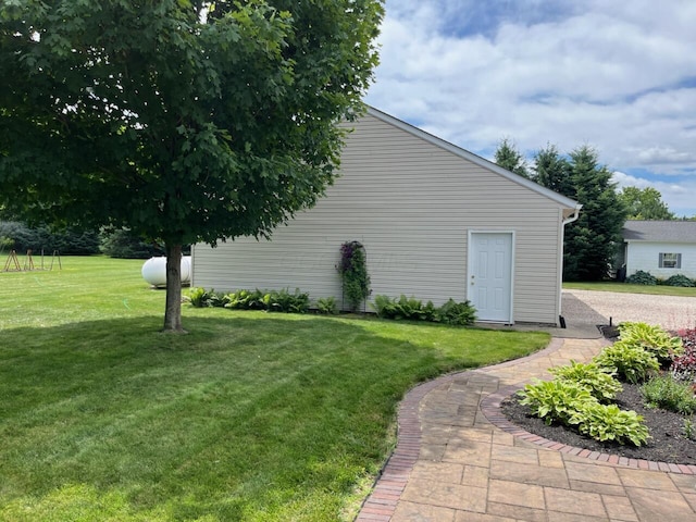 view of side of home with a lawn