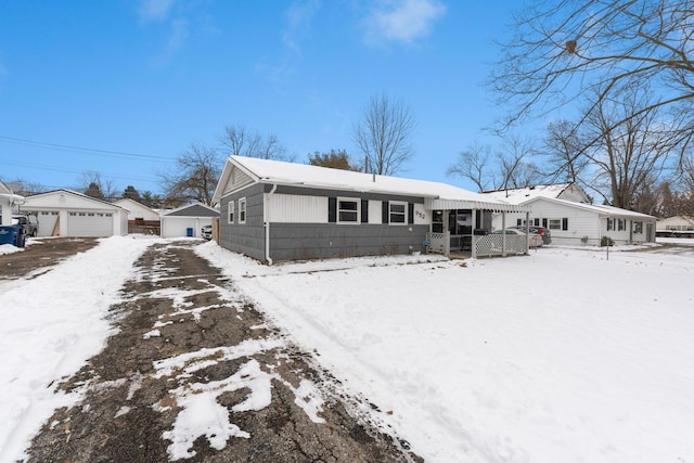 ranch-style house with an outbuilding and a garage