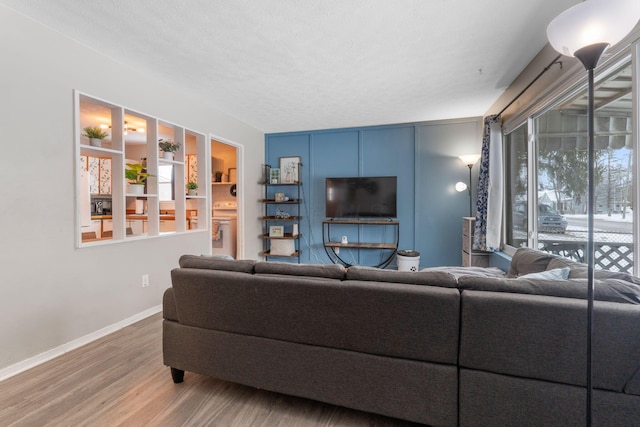 living room featuring hardwood / wood-style flooring and a healthy amount of sunlight