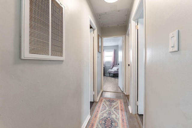 corridor featuring light hardwood / wood-style floors