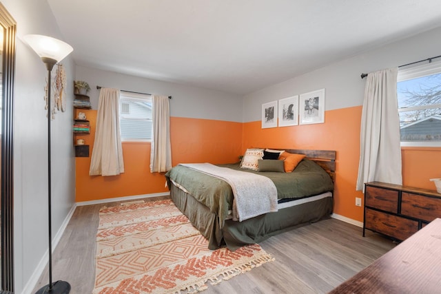 bedroom with light hardwood / wood-style flooring