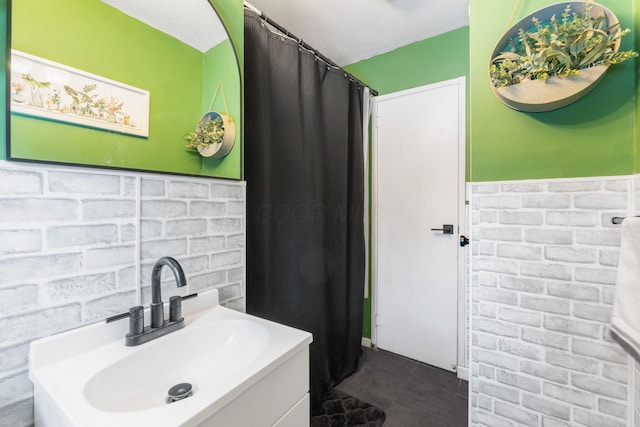 bathroom with tile patterned floors and vanity