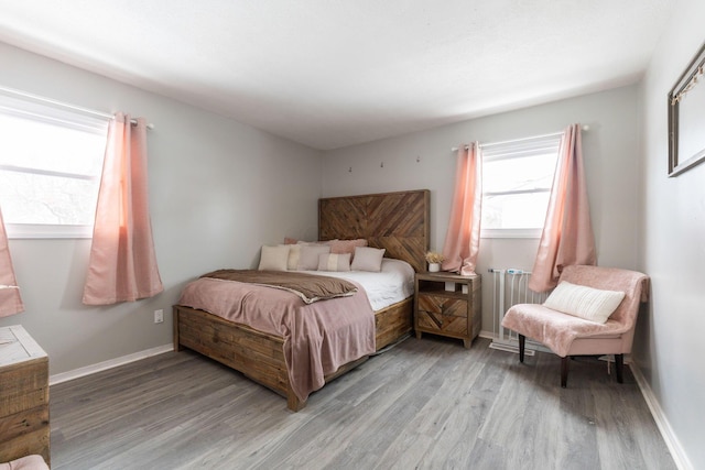 bedroom with light wood-type flooring