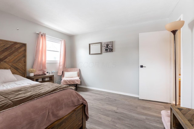 bedroom featuring light hardwood / wood-style flooring