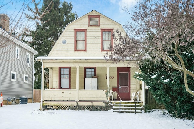 view of front of house with central AC unit and covered porch