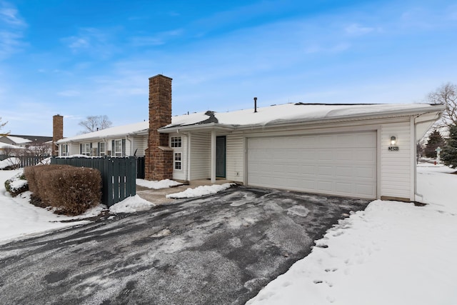 ranch-style home with a garage