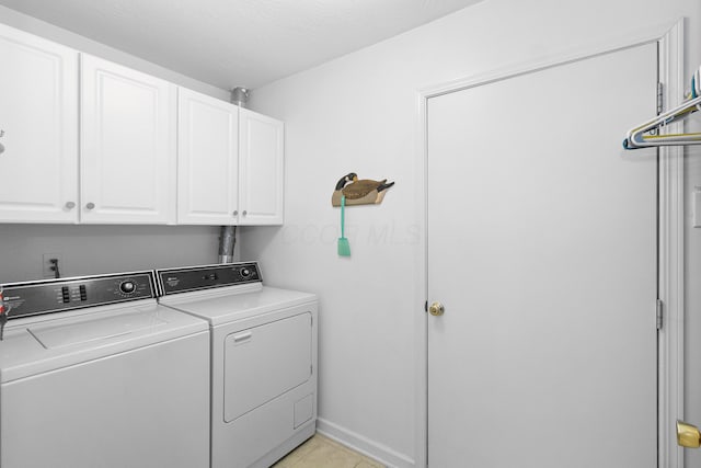 laundry area featuring cabinets and independent washer and dryer