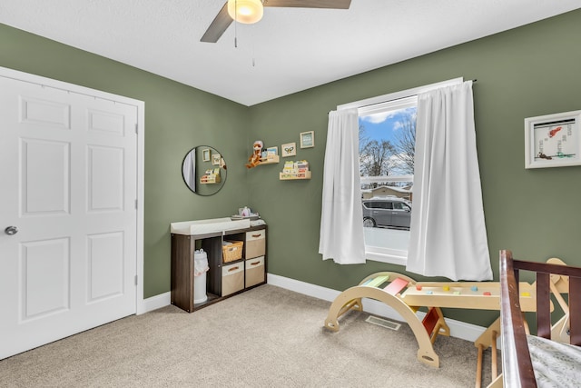 carpeted bedroom featuring ceiling fan