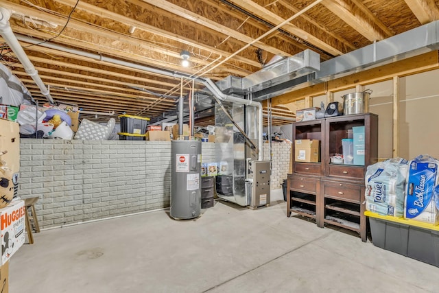 basement featuring brick wall, heating unit, and water heater