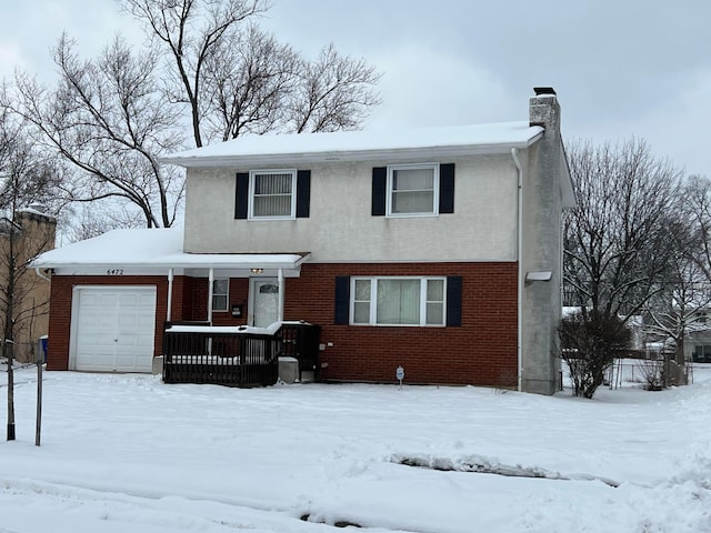 front of property with a garage