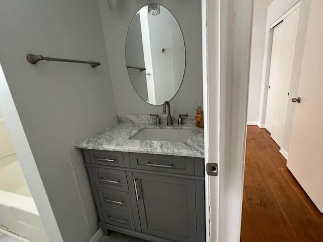 bathroom featuring vanity and wood-type flooring