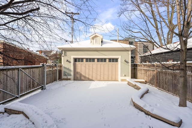 view of snow covered garage