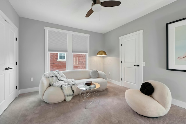 sitting room with light carpet and ceiling fan