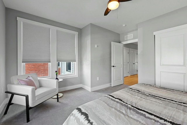 bedroom featuring ceiling fan and light colored carpet