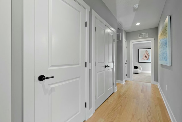 hallway with light wood-type flooring