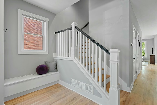 stairs with wood-type flooring