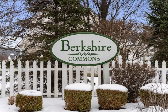 community sign featuring fence