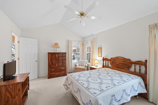 bedroom featuring ceiling fan, vaulted ceiling, and carpet flooring